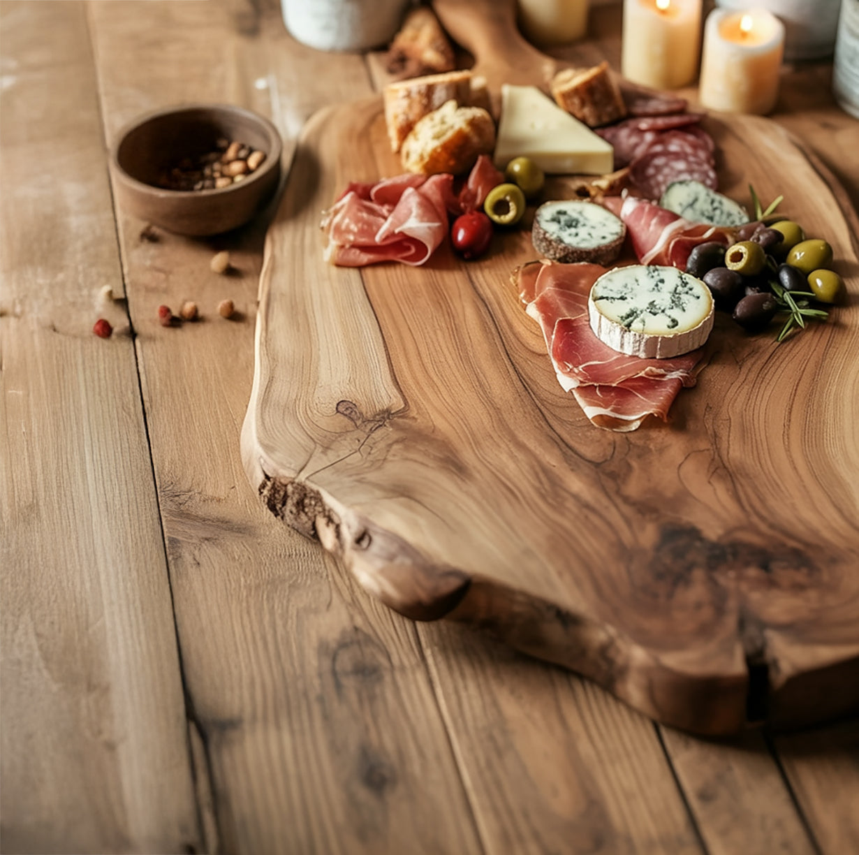 Wooden charcuterie board with prosciutto, blue cheese, olives, bread, and candles on rustic wooden table